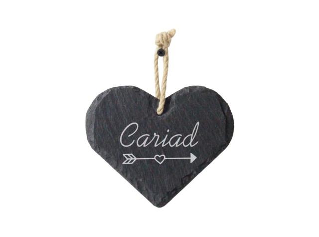 Welsh slate heart shaped hanging sign engraved with the words love laughter and happily ever after 
